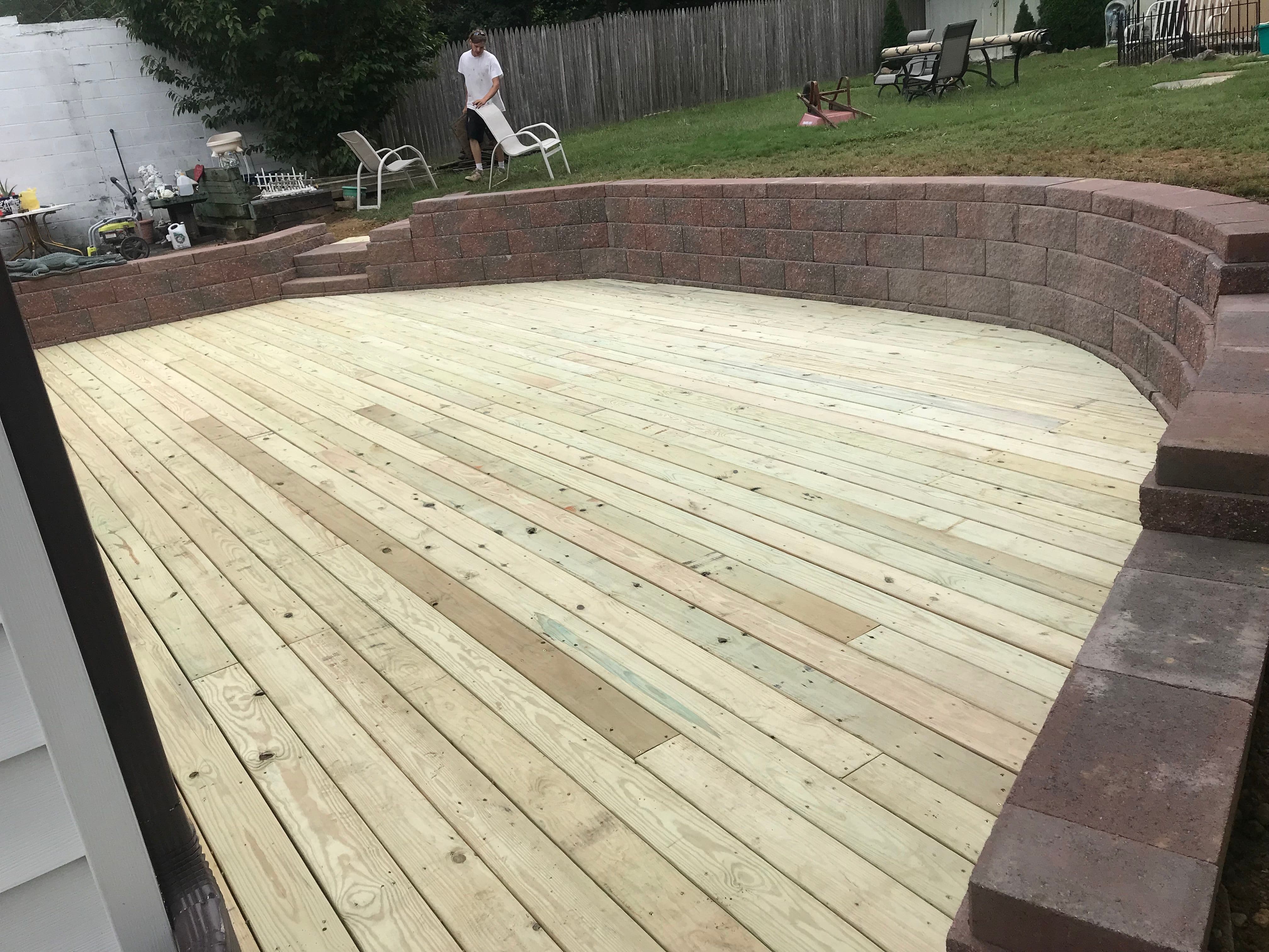 This was a very interesting little project done in Secane,
Pennsylvania. A wooden deck installed and encased with a brick knee wall with wall caps